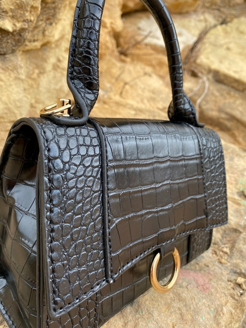 Axelremsväska med djurmönster och spänne