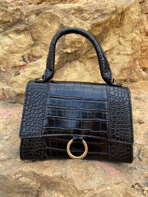 Axelväska med djurmönster och spänne