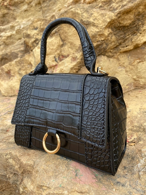 Axelväska med djurmönster och spänne