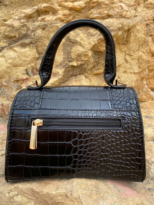 Axelremsväska med djurmönster och spänne